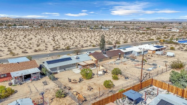 drone / aerial view with view of desert and a mountain view