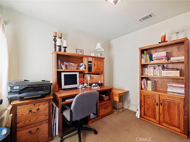 office with light carpet and visible vents