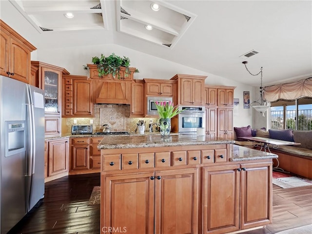 kitchen with visible vents, stainless steel appliances, dark wood-type flooring, custom range hood, and open floor plan