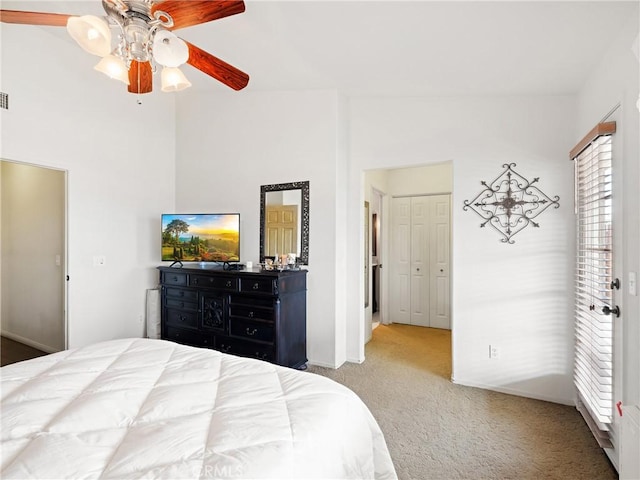 carpeted bedroom featuring visible vents, baseboards, and a ceiling fan