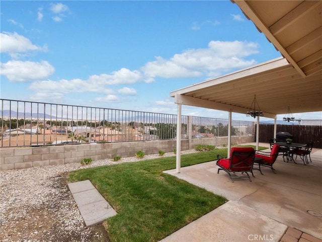 view of yard with a fenced backyard and a patio