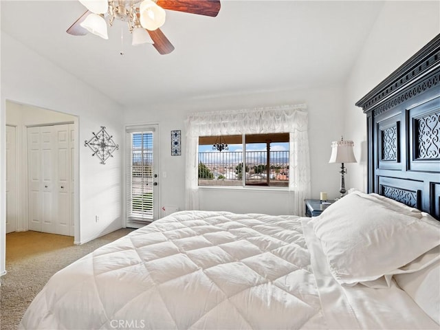 bedroom featuring access to outside, vaulted ceiling, a ceiling fan, and carpet floors