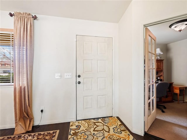 entrance foyer featuring french doors and baseboards