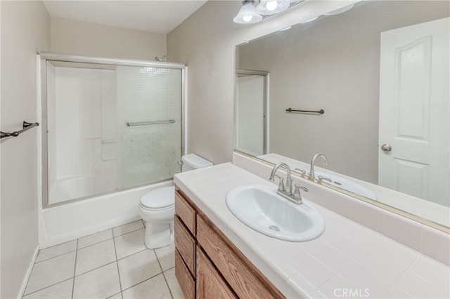 full bath with tile patterned flooring, toilet, vanity, and shower / bathing tub combination