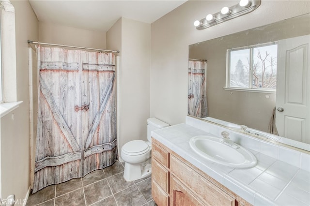 bathroom with vanity, tile patterned floors, toilet, and a shower with curtain