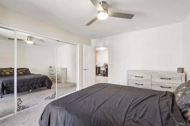 bedroom with a closet, a ceiling fan, and carpet floors