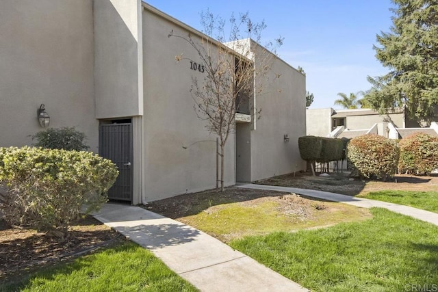 view of property exterior with stucco siding