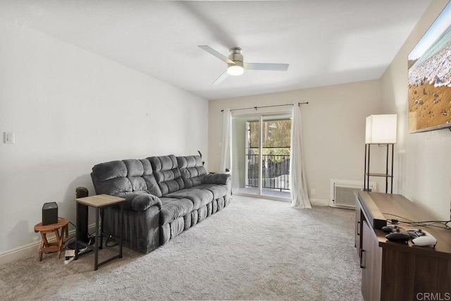 living room with visible vents, baseboards, carpet, and ceiling fan