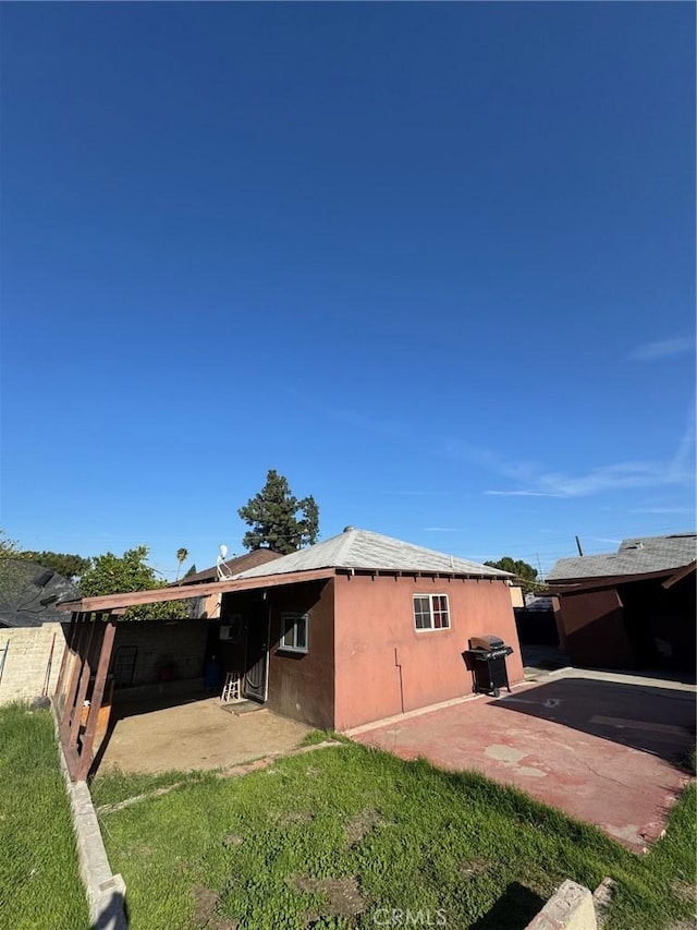 view of property exterior featuring a patio and stucco siding