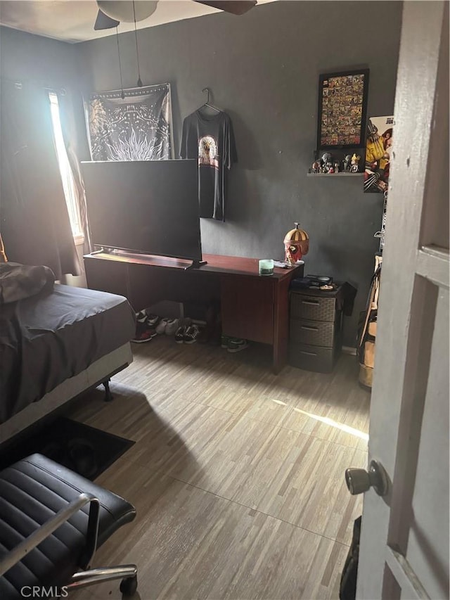 bedroom featuring wood finished floors