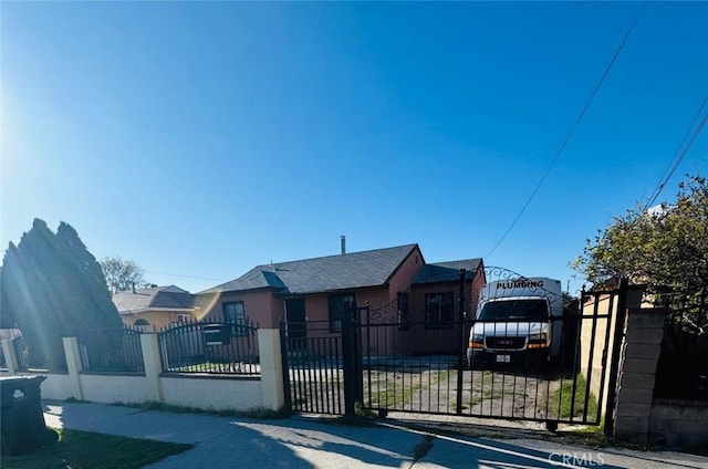 view of front of property with a gate and a fenced front yard