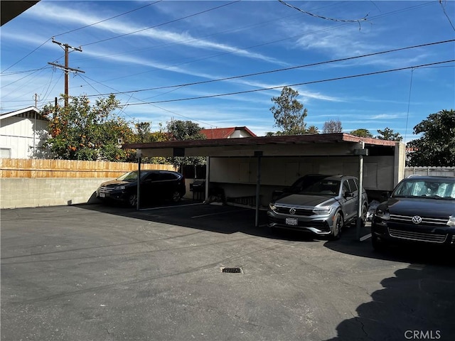 covered parking lot with fence