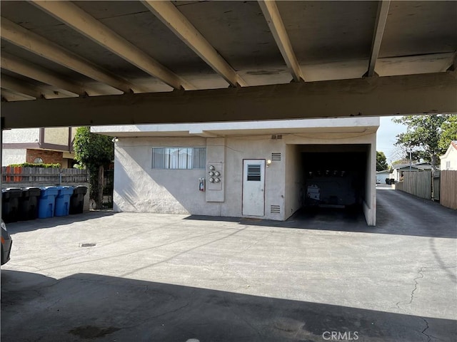 garage with fence