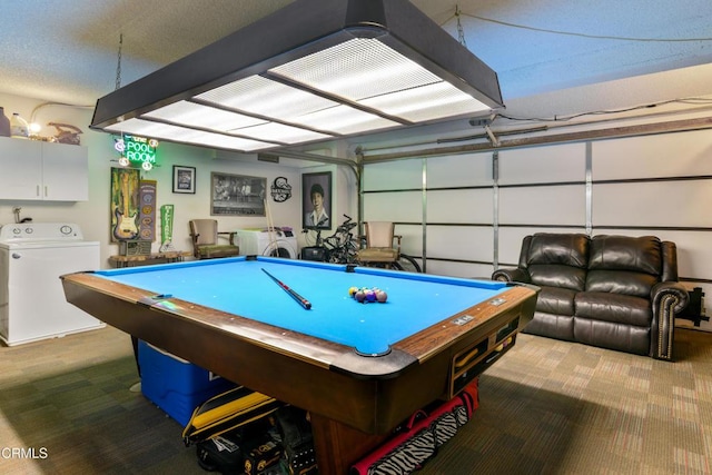 playroom featuring washer / dryer, pool table, a garage, a textured ceiling, and carpet flooring