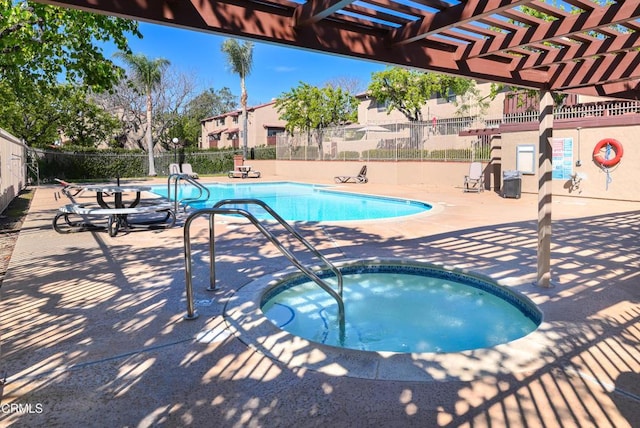 community pool featuring a patio, fence, a pergola, and a hot tub