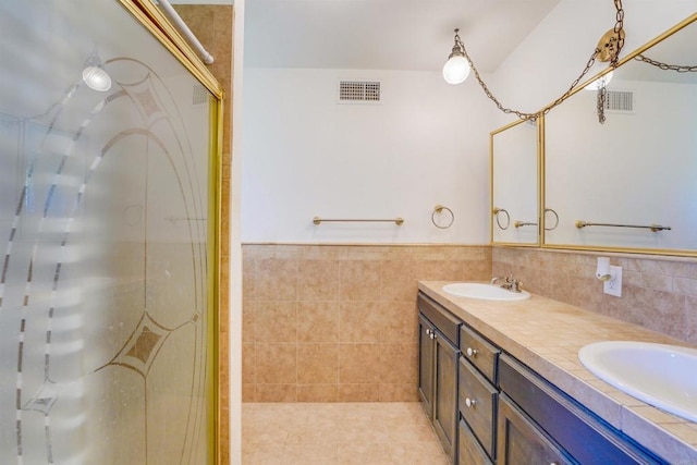 full bath featuring a shower stall, visible vents, and a sink