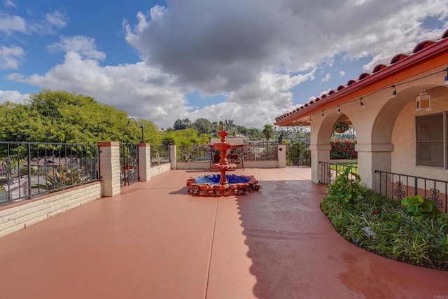 view of patio / terrace featuring fence