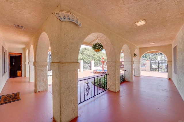 view of patio featuring a balcony