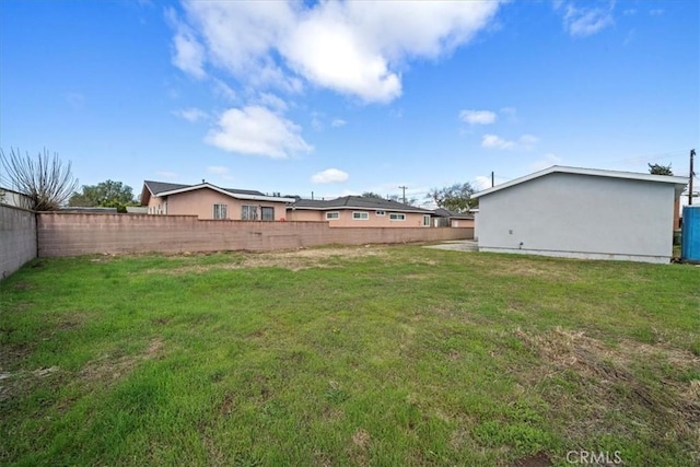 view of yard with a fenced backyard