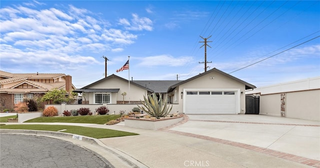 ranch-style home featuring stucco siding, driveway, fence, a front yard, and an attached garage