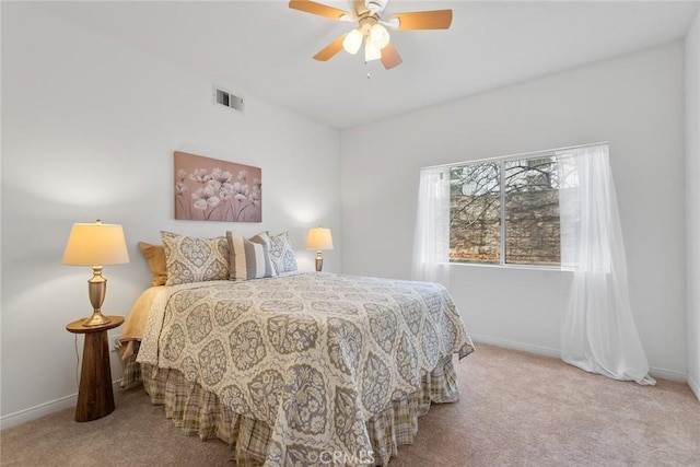 bedroom featuring visible vents, baseboards, carpet, and a ceiling fan