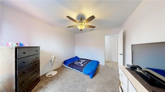 bedroom featuring light carpet, visible vents, and a ceiling fan