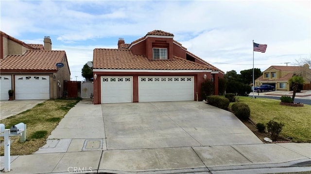 mediterranean / spanish-style home with stucco siding, a tile roof, fence, concrete driveway, and a chimney