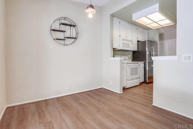 kitchen featuring baseboards, white appliances, light wood-style floors, and white cabinetry