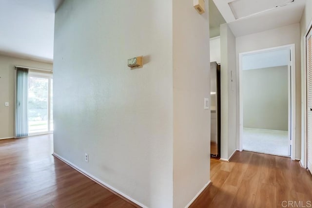 hallway with wood finished floors