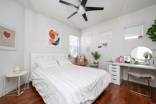 bedroom with baseboards, ceiling fan, and wood finished floors