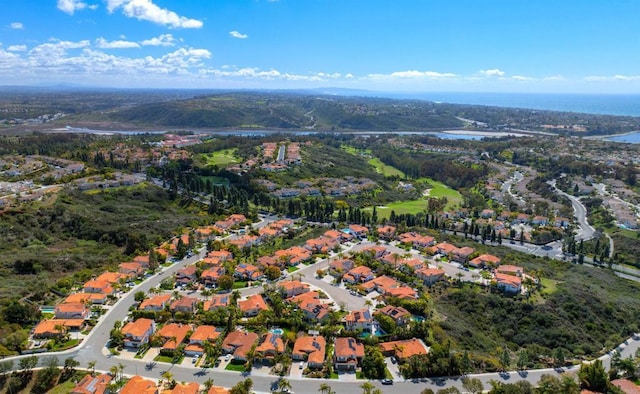 drone / aerial view with a residential view and a water view