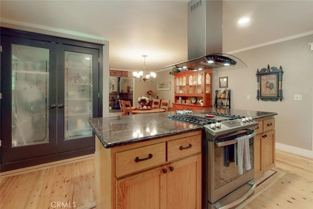 kitchen featuring a center island, crown molding, gas range, light wood-style flooring, and island range hood