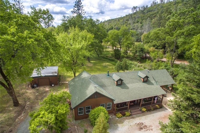 aerial view featuring a wooded view