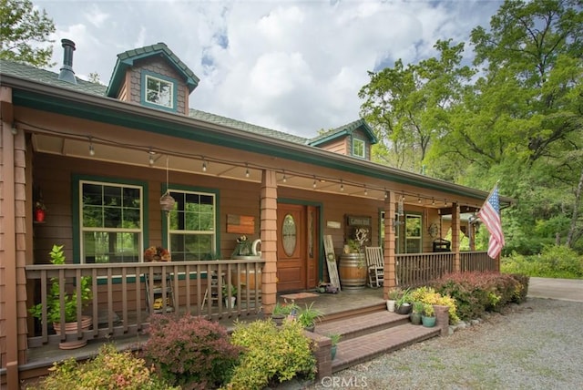 property entrance featuring covered porch