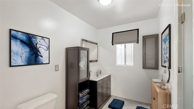 bathroom with toilet and vanity