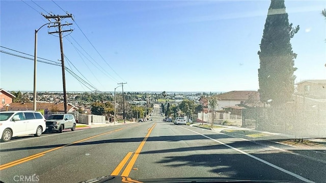 view of road with sidewalks and a residential view