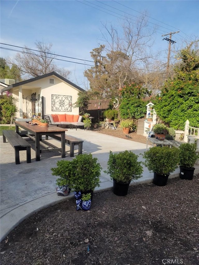 view of yard featuring a patio, fence, and an outdoor living space