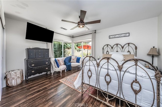 bedroom with a ceiling fan, wood finished floors, and visible vents