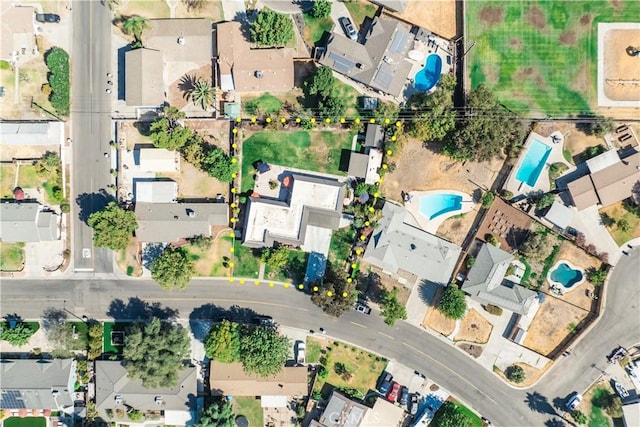 birds eye view of property with a residential view