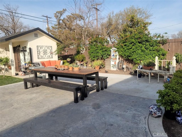 view of patio / terrace with outdoor dining area and fence