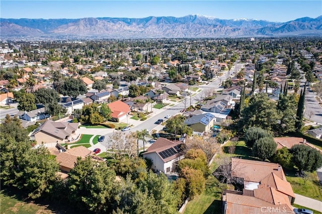 birds eye view of property with a mountain view and a residential view