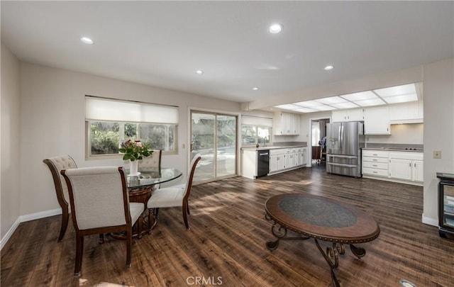 dining area featuring dark wood-type flooring, recessed lighting, and baseboards