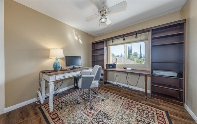 office space with a ceiling fan, wood finished floors, and baseboards