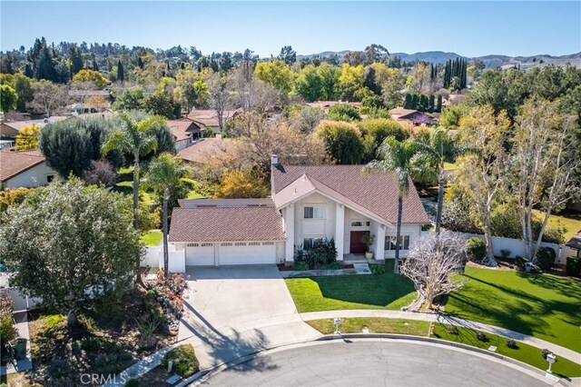 birds eye view of property featuring a mountain view