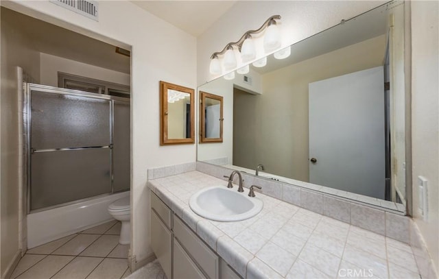 full bathroom with tile patterned flooring, visible vents, toilet, and vanity