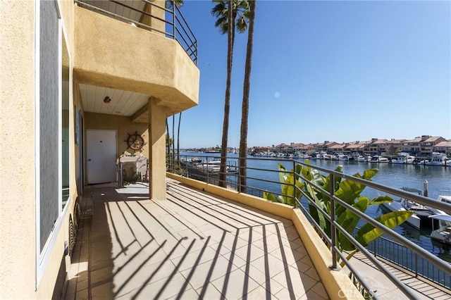 balcony featuring a water view