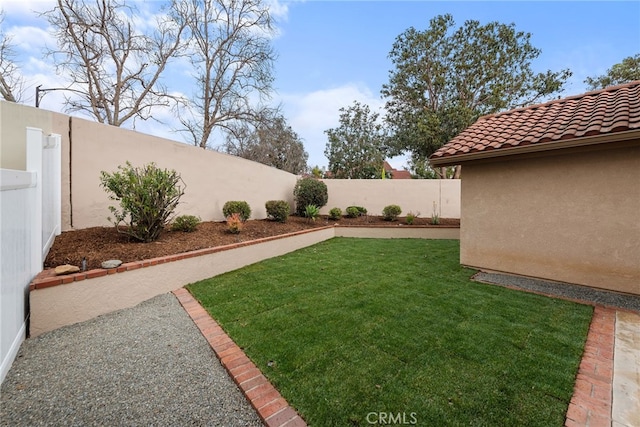 view of yard with a fenced backyard