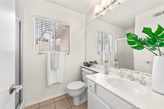 bathroom with baseboards, visible vents, a stall shower, tile patterned flooring, and toilet