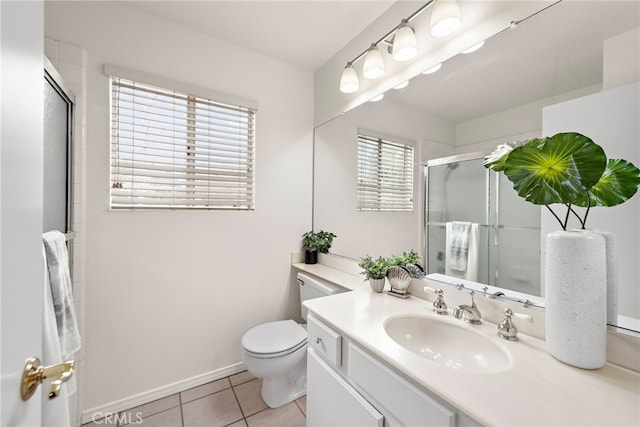 bathroom with baseboards, toilet, tile patterned floors, an enclosed shower, and vanity