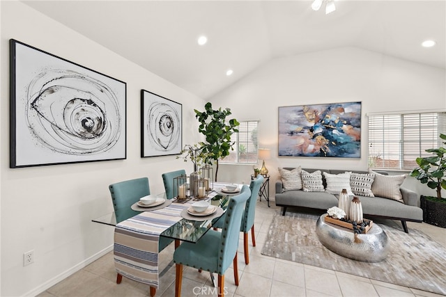 tiled dining room featuring recessed lighting, baseboards, and lofted ceiling